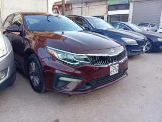 كيا أوبتيما 2020 حمراء سيدان أوتوماتيك بكاميرا خلفية وهاردتوب للإيجار في البغطاسية، حمص