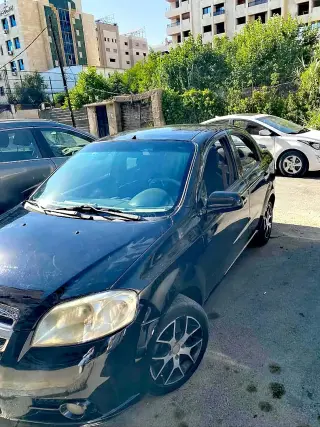 شيفروليه أفيو سيدان أوتوماتيك موديل 2007 أسود بمحرك 1600 وبكاميرا خلفية في قدسيا