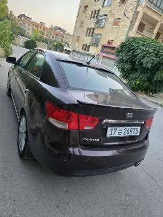 كيا فورتي سيدان 2010 سوداء أوتوماتيك بمحرك 1600 سي سي في حلب